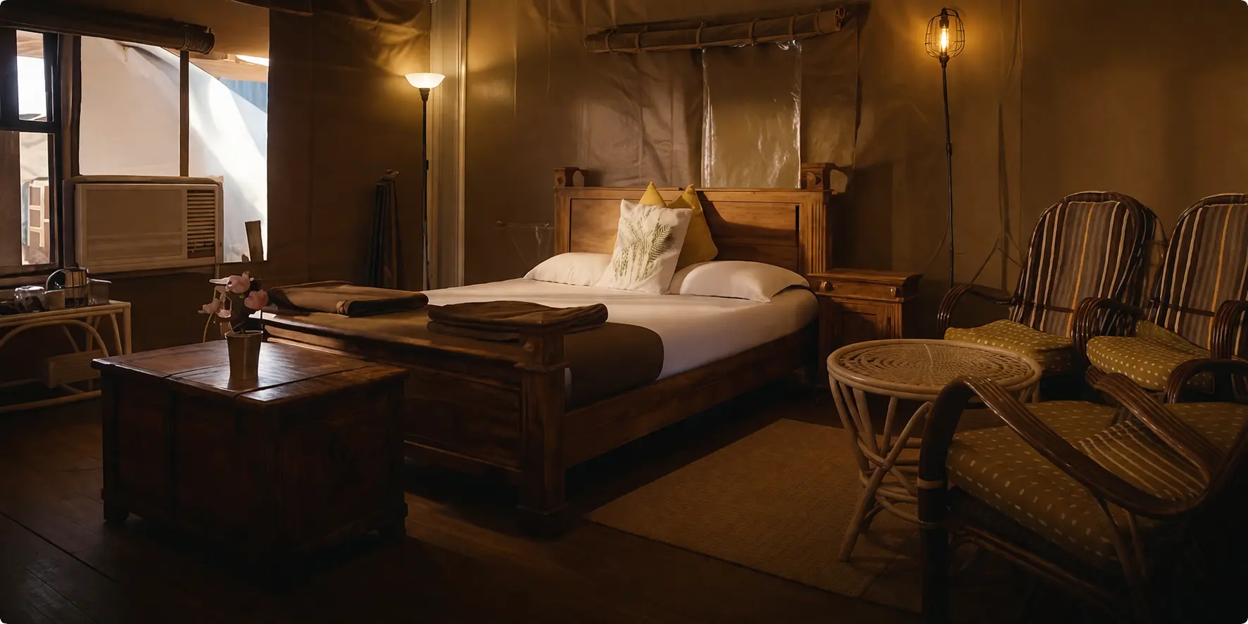 Luxury jungle stay room near Tipeshwar Wildlife Sanctuary with warm lighting and wooden interiors